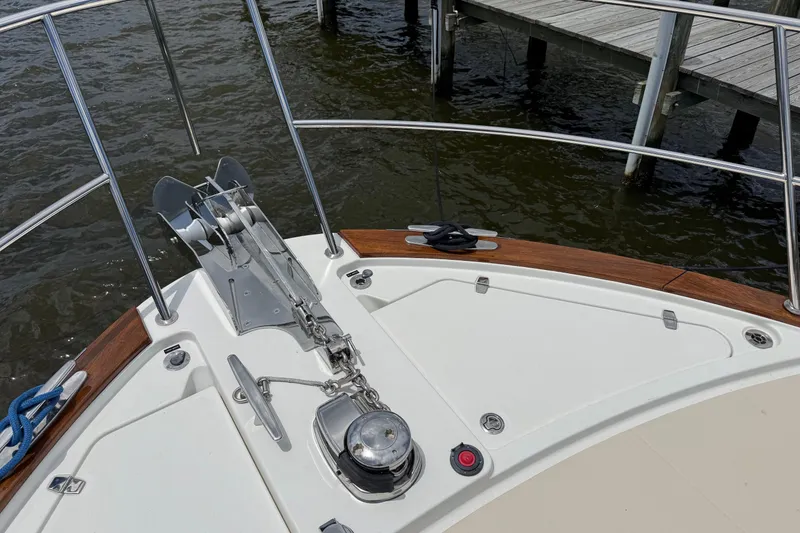 Slide: The Image of Bow of 2019 Sabre 45 Salon Express yacht with anchor and railing. - 2