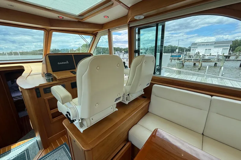 Slide: The Image of Interior of 2019 Sabre 45 Salon Express yacht with helm and seating area. - 20