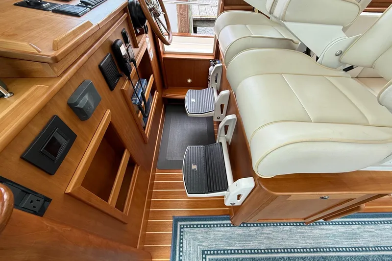 Slide: The Image of Interior of 2019 Sabre 45 Salon Express with leather seating and wooden accents. - 22