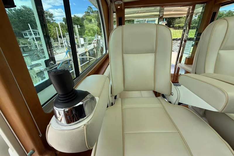 Slide: The Image of Luxurious interior of 2019 Sabre 45 Salon Express yacht with plush seating and joystick control. - 23