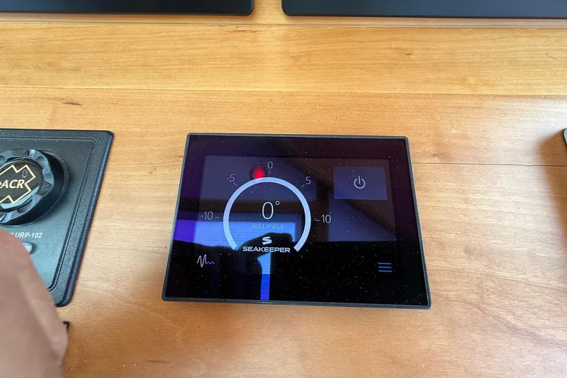 Slide: The Image of Seakeeper control panel on 2019 Sabre 45 Salon Express yacht dashboard. - 24
