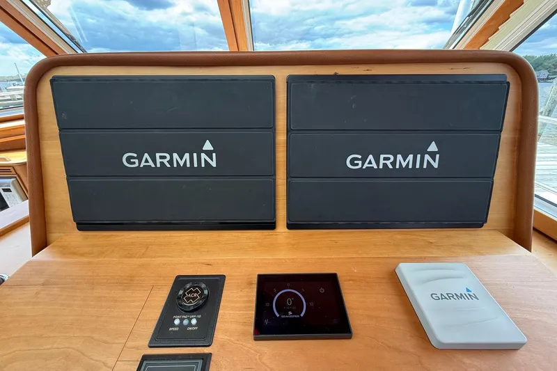 Slide: The Image of Dashboard of 2019 Sabre 45 Salon Express with Garmin navigation displays. - 25