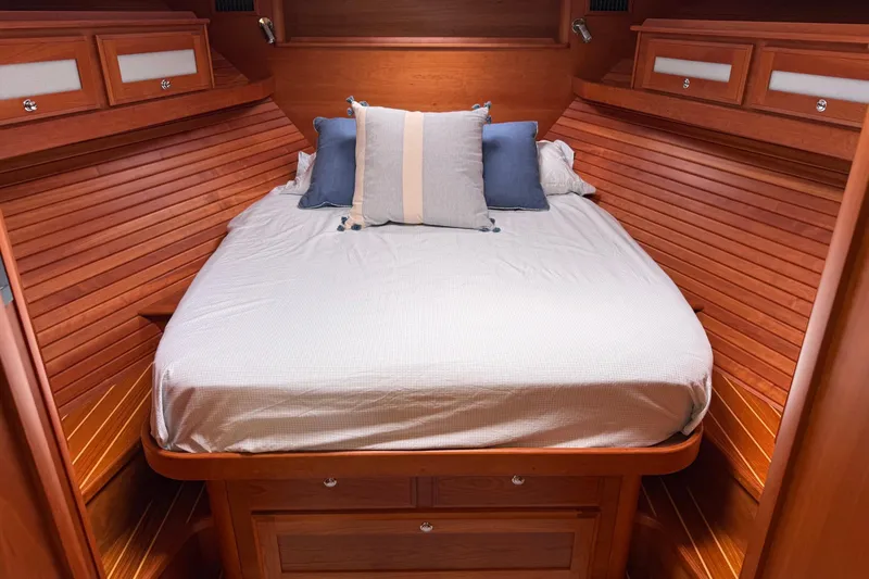 Slide: The Image of Luxurious cabin interior of 2019 Sabre 45 Salon Express with cozy bed and wooden finish. - 31