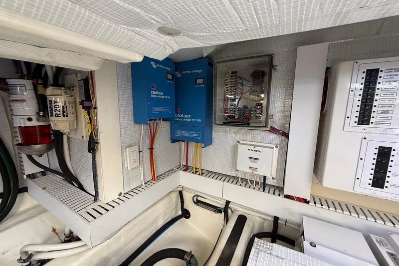 Slide: The Image of Electrical system of 2019 Sabre 45 Salon Express with battery chargers and control panels. - 40