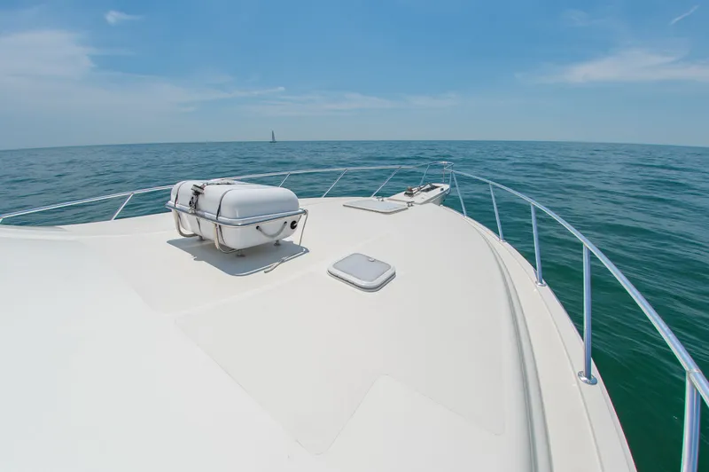 Slide: The Image of Bertram 510 Convertible 2008 on calm sea under blue sky. - 18