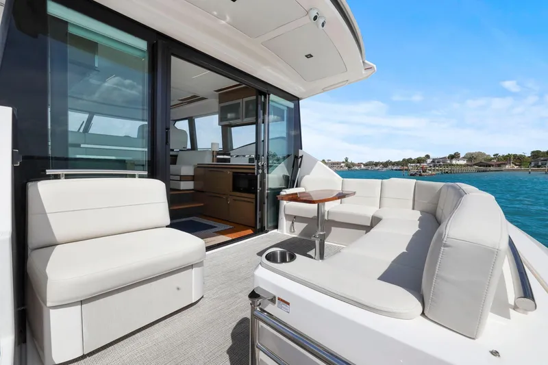 Slide: The Image of Luxurious 2023 Tiara Yachts C49 Coupe with elegant seating and ocean view. - 23