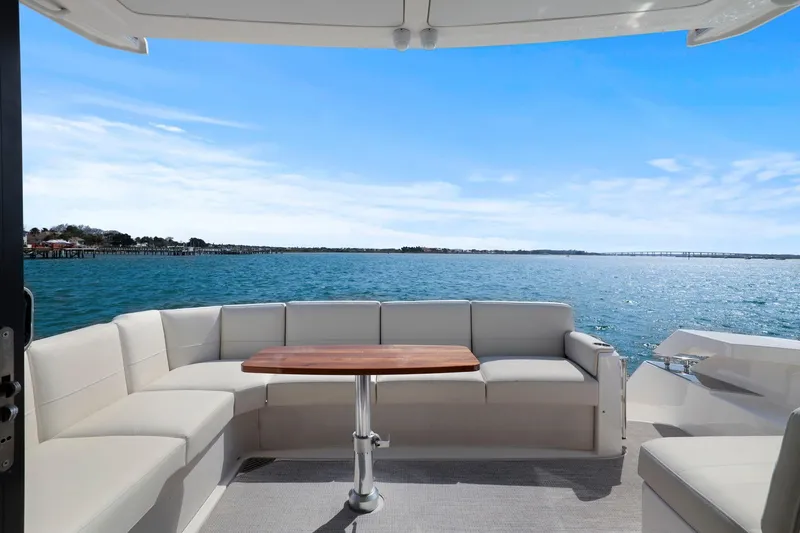 Slide: The Image of 2023 Tiara Yachts C49 Coupe, elegant seating area with ocean view. - 26