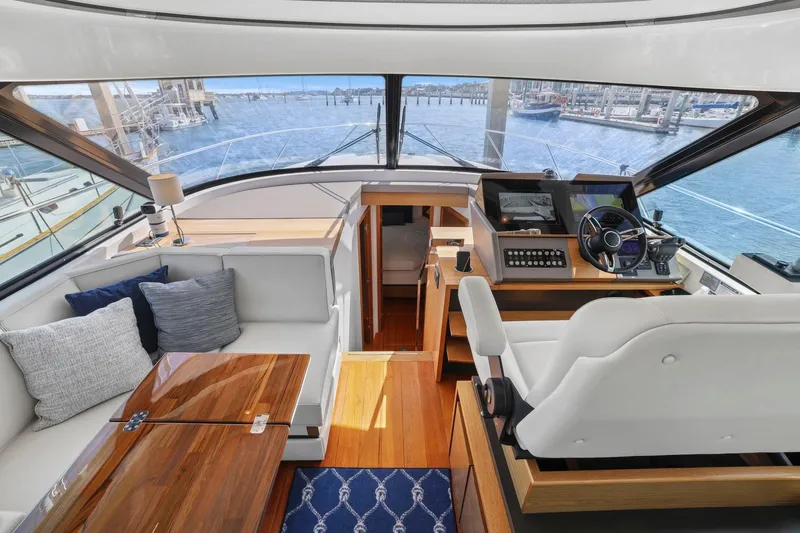 Slide: The Image of Luxurious interior of 2023 Tiara Yachts C49 Coupe with helm and seating area. - 30