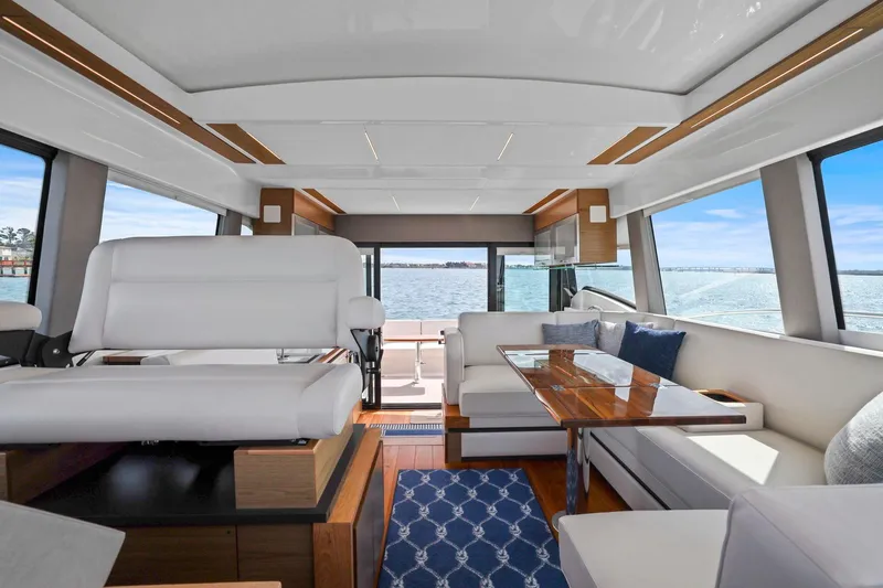 Slide: The Image of Luxurious interior of 2023 Tiara Yachts C49 Coupe with elegant seating and ocean view. - 36