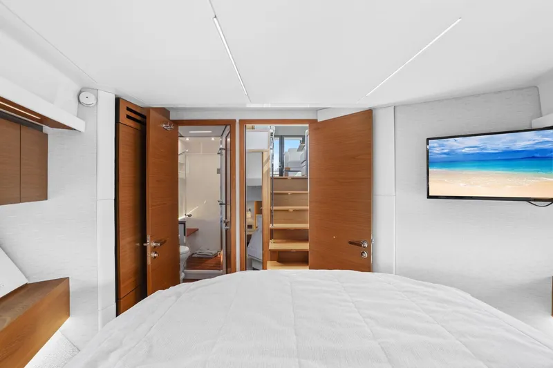 Slide: The Image of Luxurious interior of 2023 Tiara Yachts C49 Coupe with modern design and beach view on TV. - 67