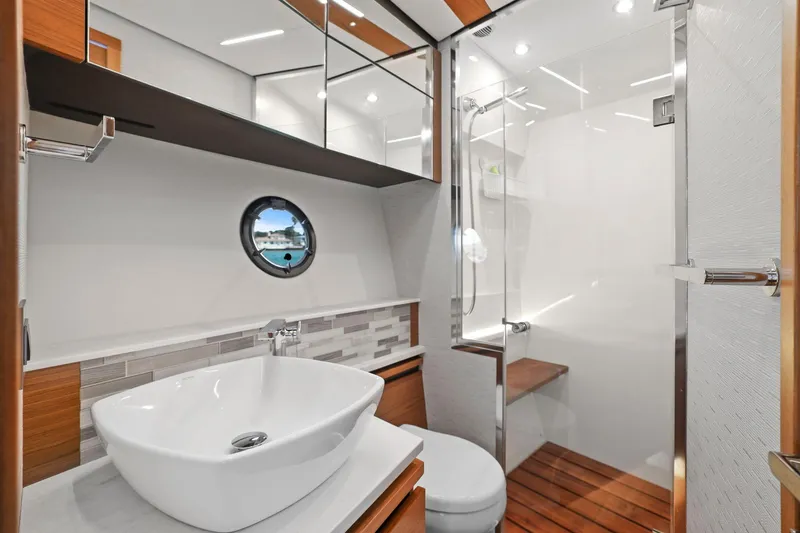 Slide: The Image of Luxurious bathroom in 2023 Tiara Yachts C49 Coupe with modern fixtures and elegant design. - 69