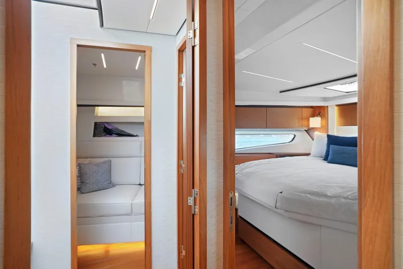 Slide: The Image of Luxurious interior of 2023 Tiara Yachts C49 Coupe, featuring cozy bedroom and seating area. - 73
