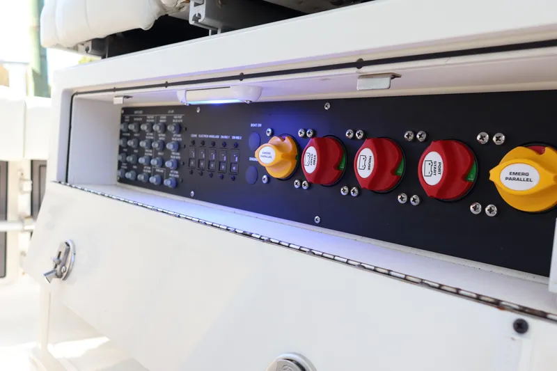 Slide: The Image of Control panel of 2022 World Cat 280 CC-X boat with switches and dials. - 26