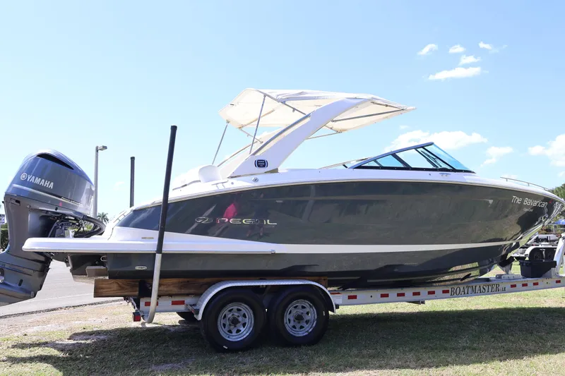 Slide: The Image of 2019 Regal 29 OBX boat on trailer with Yamaha outboard motor. - 4