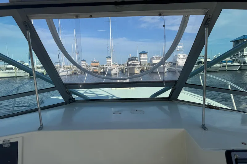 Slide: The Image of View from a 1984 Topaz 37 boat cockpit overlooking a marina with docked yachts. - 10