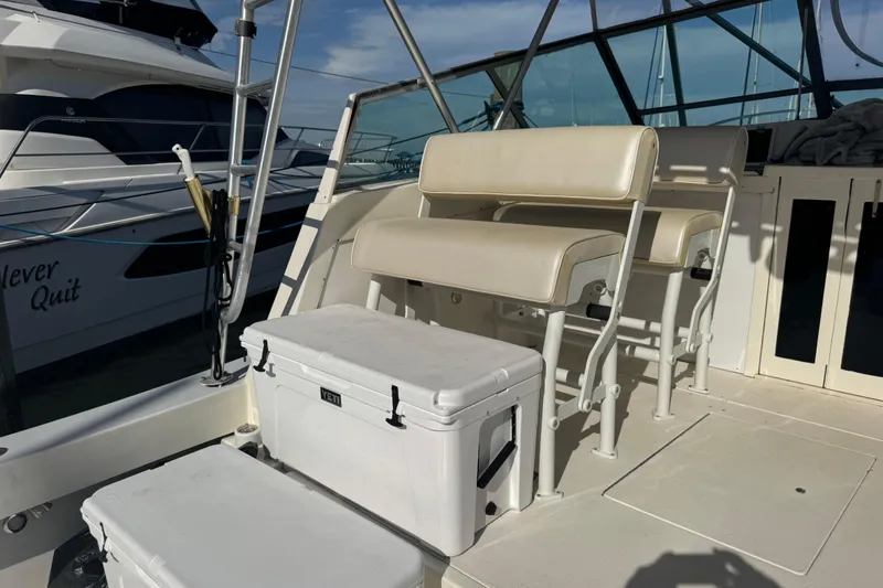 Slide: The Image of Interior of a 1984 Topaz 37 boat with seating and coolers. - 12