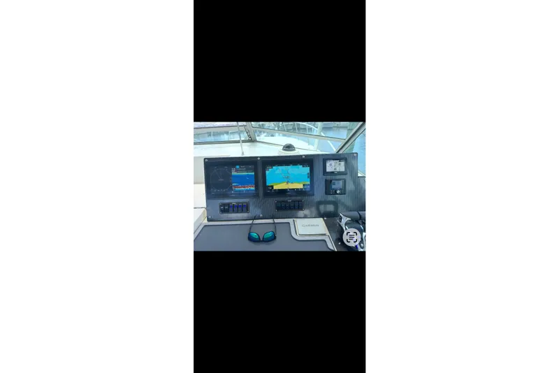 Slide: The Image of Boat cockpit with navigation screens and controls, Topaz 37, 1984 model. - 3