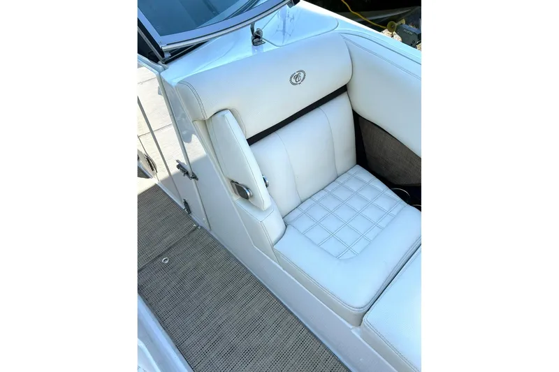 Slide: The Image of 2017 Cobalt R5 boat interior with white cushioned seating and elegant design. - 10