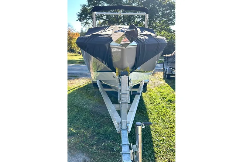 Slide: The Image of 2017 Cobalt R5 boat on trailer, covered, parked on grass. - 3