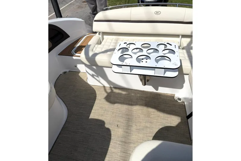 Slide: The Image of 2017 Cobalt R5 boat interior with cup holder and cushioned seating. - 5