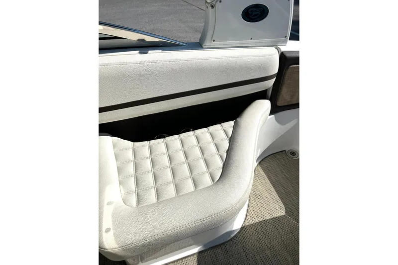 Slide: The Image of 2017 Cobalt R5 boat interior with white cushioned seating and textured flooring. - 6