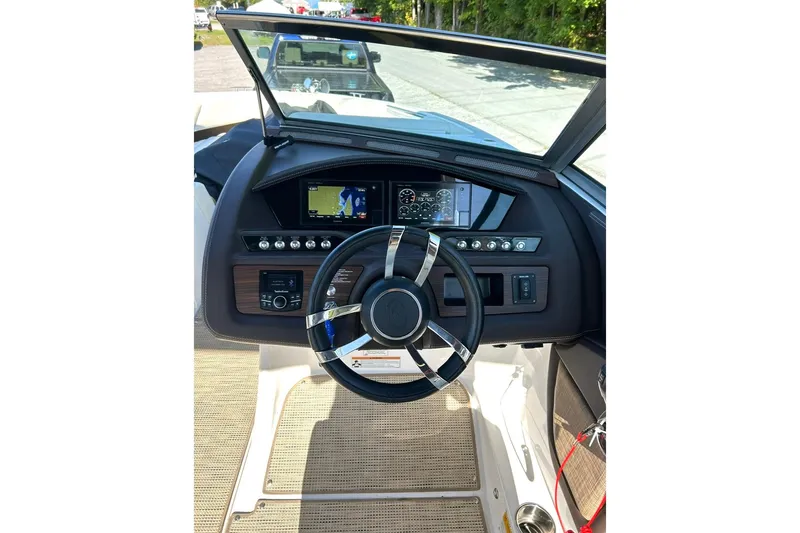 Slide: The Image of Steering console of a 2017 Cobalt R5 boat with modern controls and navigation display. - 7