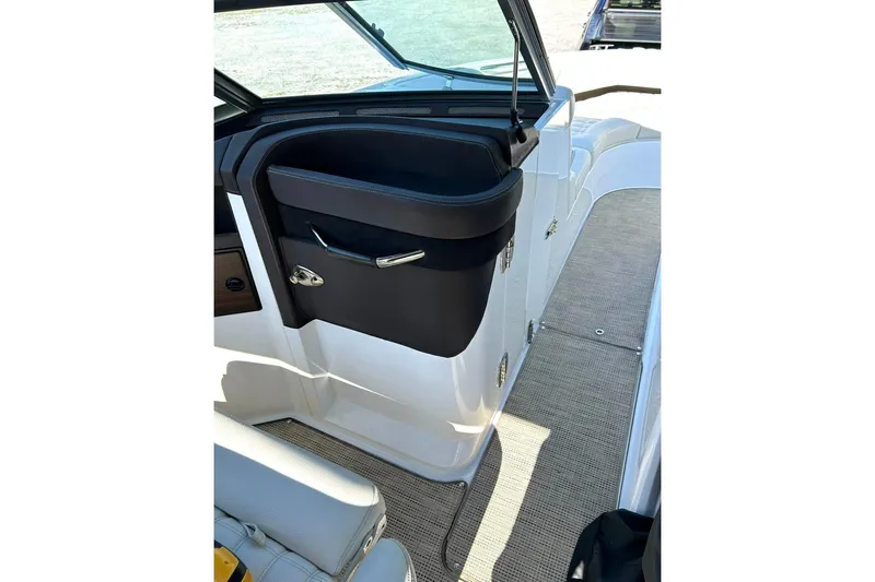 Slide: The Image of 2017 Cobalt R5 boat interior with sleek black and white design, featuring modern seating. - 8
