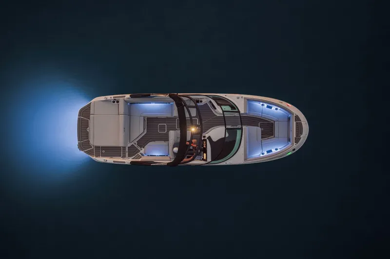 Slide: The Image of Aerial view of a Sea Ray SDX 250 boat with glowing lights on dark water. - 20