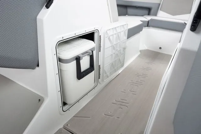 Slide: The Image of Interior of 2027 Scarab Jet Boats 235 SE with storage compartment. - 17
