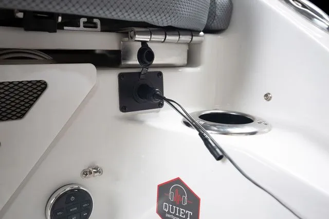 Slide: The Image of Interior view of 2027 Scarab Jet Boats 235 SE with audio connection. - 26