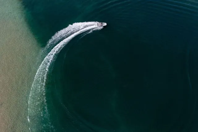 Slide: The Image of Scarab Jet Boats 235 SE 2027 on water, aerial view. - 28