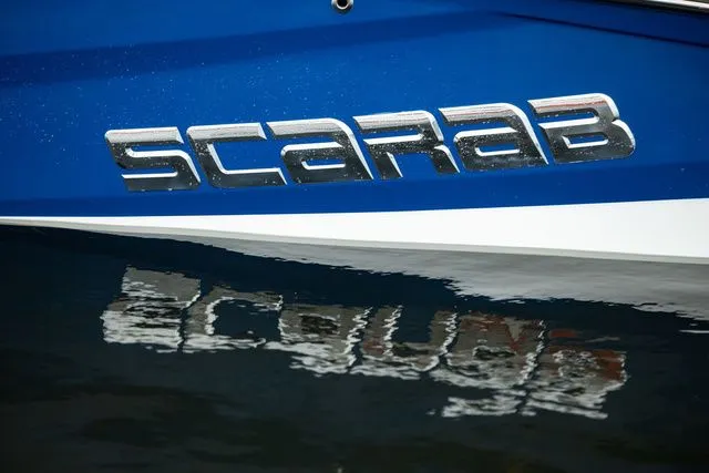 Slide: The Image of Scarab Jet Boats 235 SE 2027 reflected on water. - 29