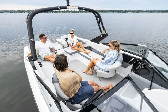 Slide: The Image of Scarab Jet Boats 235 SE 2027 on calm water with passengers. - 4