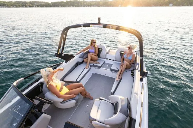 Slide: The Image of Scarab Jet Boats 235 SE 2027 on water at sunset. - 7