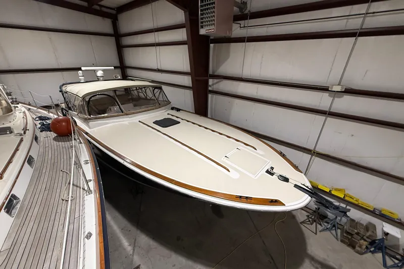 Slide: The Image of 1979 Magnum 38 Sport boat stored indoors, showcasing sleek design and classic style. - 3