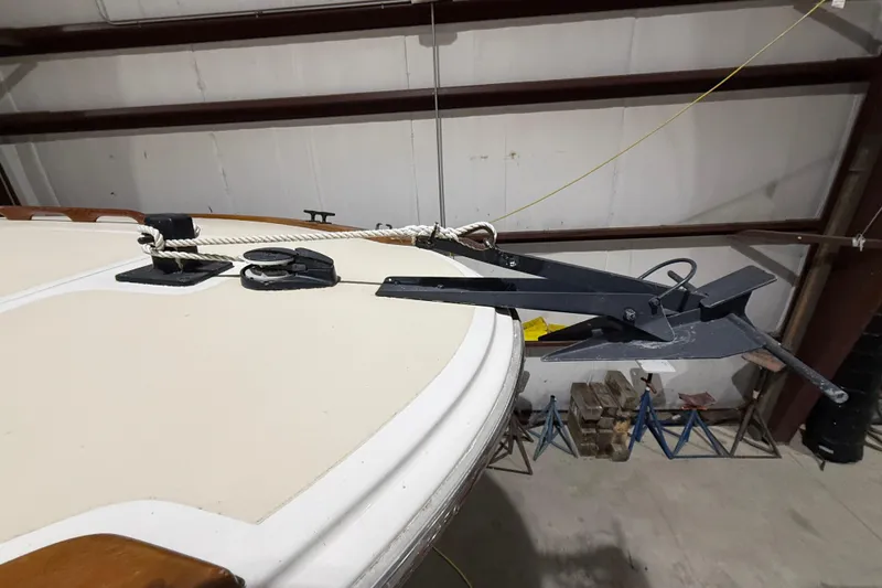 Slide: The Image of 1979 Magnum 38 Sport boat anchor setup in a storage facility. - 15