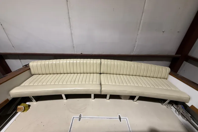 Slide: The Image of Cream-colored bench seating on a 1979 Magnum 38 Sport boat. - 18