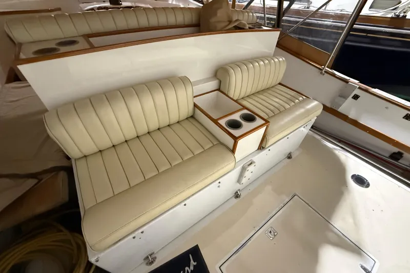 Slide: The Image of Cream leather seating on a 1979 Magnum 38 Sport boat with cup holders. - 21