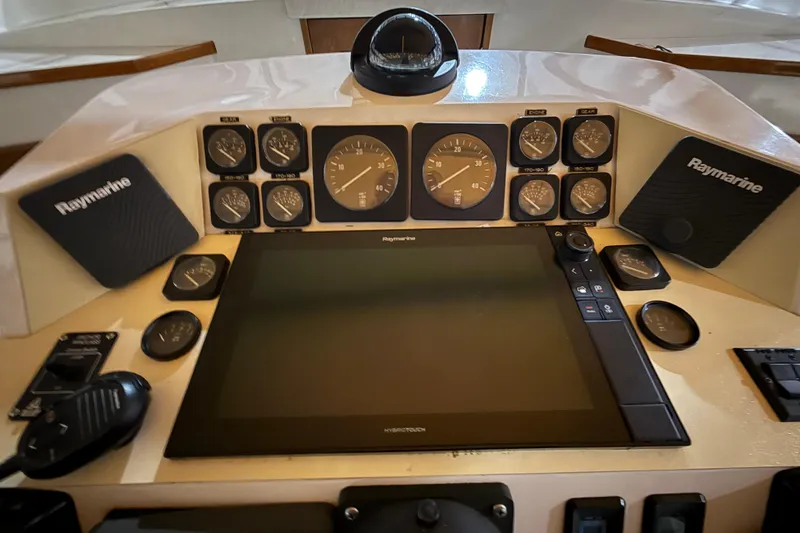 Slide: The Image of Control panel of a 1979 Magnum 38 Sport boat with Raymarine electronics. - 32
