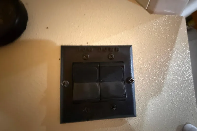Slide: The Image of Close-up of a vintage Magnum 38 Sport switch panel from 1979, mounted on a wall. - 35