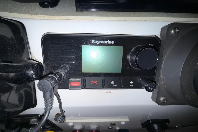 Slide: The Image of Raymarine marine radio on 1979 Magnum 38 Sport boat dashboard. - 36