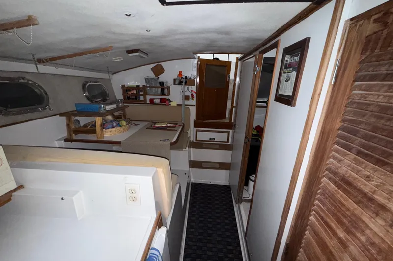 Slide: The Image of Interior of a 1979 Magnum 38 Sport boat, featuring cozy cabin amenities. - 41