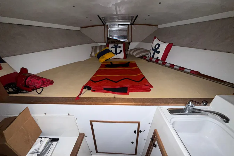 Slide: The Image of Interior cabin of a 1979 Magnum 38 Sport boat with nautical-themed decor. - 44