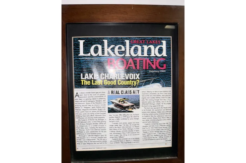 Slide: The Image of Framed "Lakeland Boating" magazine cover, February 1999, featuring Magnum 38 Sport, 1979. - 59