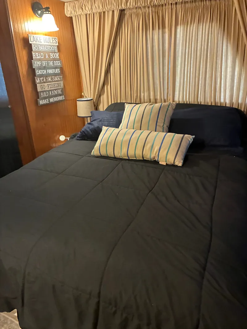 Slide: The Image of Cozy bedroom in a 1993 Gibson 50 houseboat. - 14