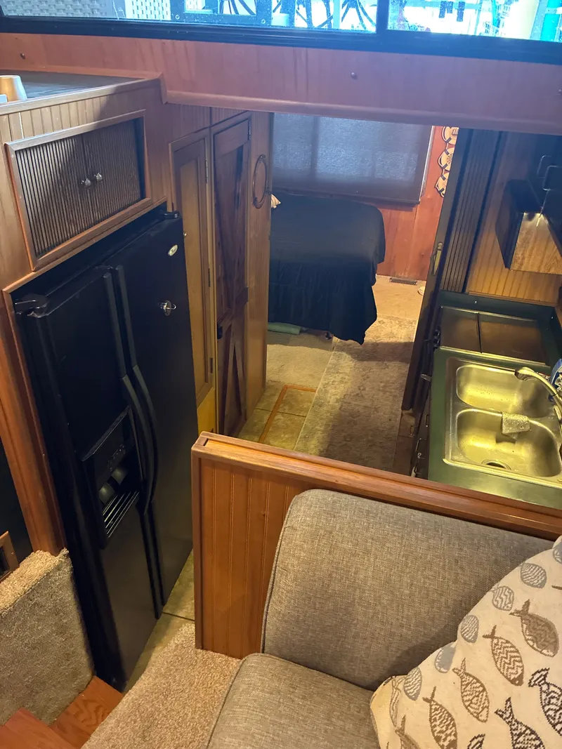 Slide: The Image of Interior of a 1993 Gibson 50 yacht with kitchen and sleeping area. - 15