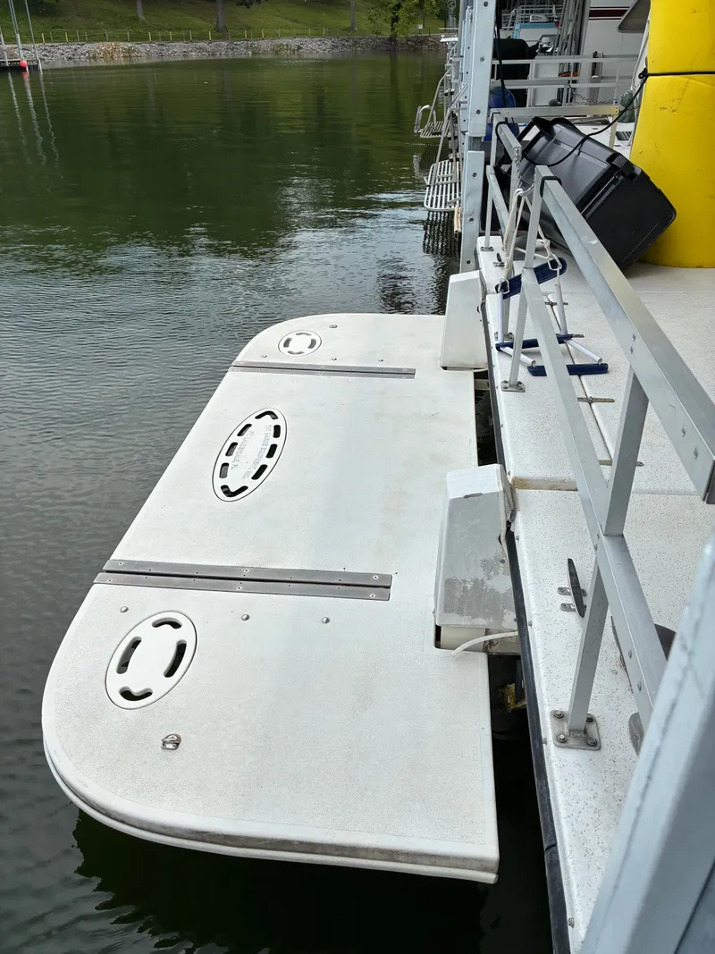 Slide: The Image of 1993 Gibson 50 boat docked at a marina. - 2