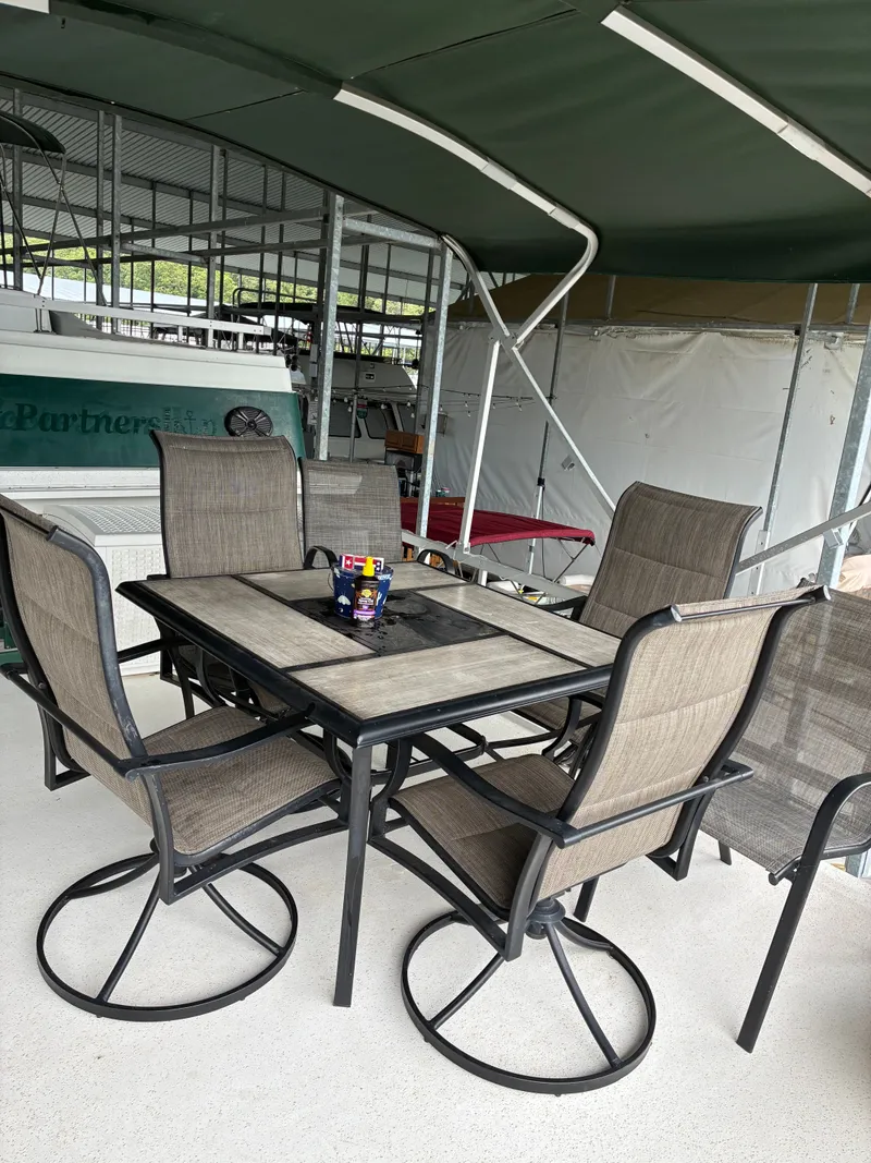 Slide: The Image of Patio furniture on a 1993 Gibson 50 boat. - 5