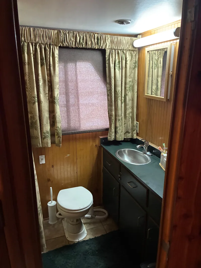 Slide: The Image of Compact bathroom in a 1993 Gibson 50 boat. - 8