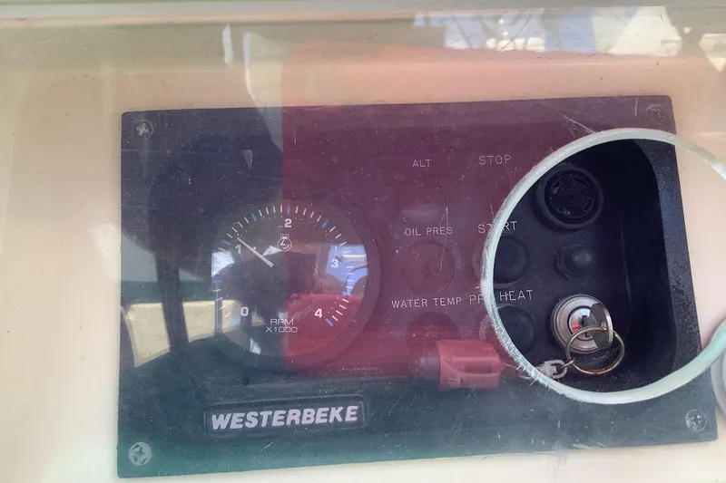 Slide: The Image of Control panel of a 1994 Caliber Cutter Rig sailboat with Westerbeke engine gauge. - 15